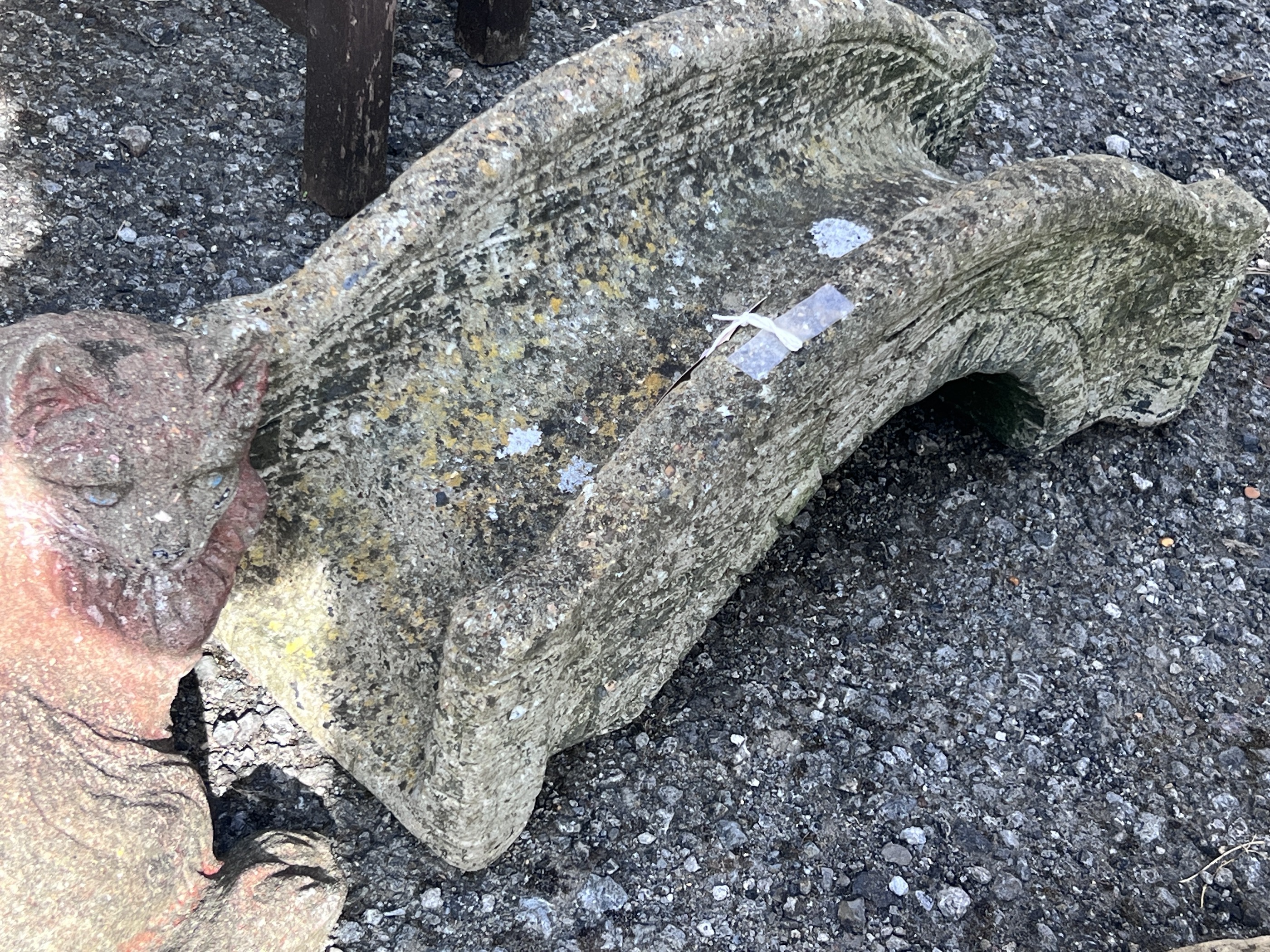 A reconstituted stone ornamental bridge garden ornament, length 59cm, height 25cm, together with a seated cat ornament